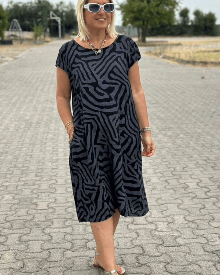 Elia - Summer dress with a round neck and a beautiful print